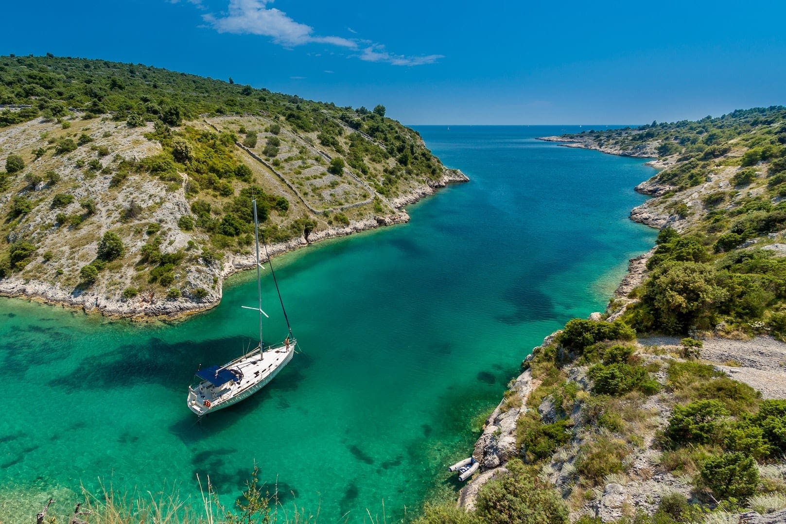 A yacht moored in a secluded cove in Croatia