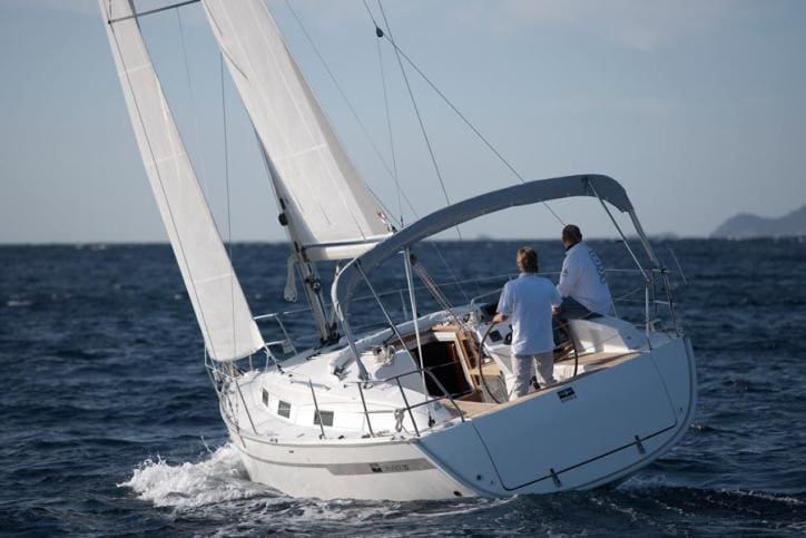 Bavaria Cruiser 32 sloop under sail on open water showing the single-mast rig with mainsail and overlapping headsail — a sloop is the most common sailing configuration: one mast, one mainsail, one headsail