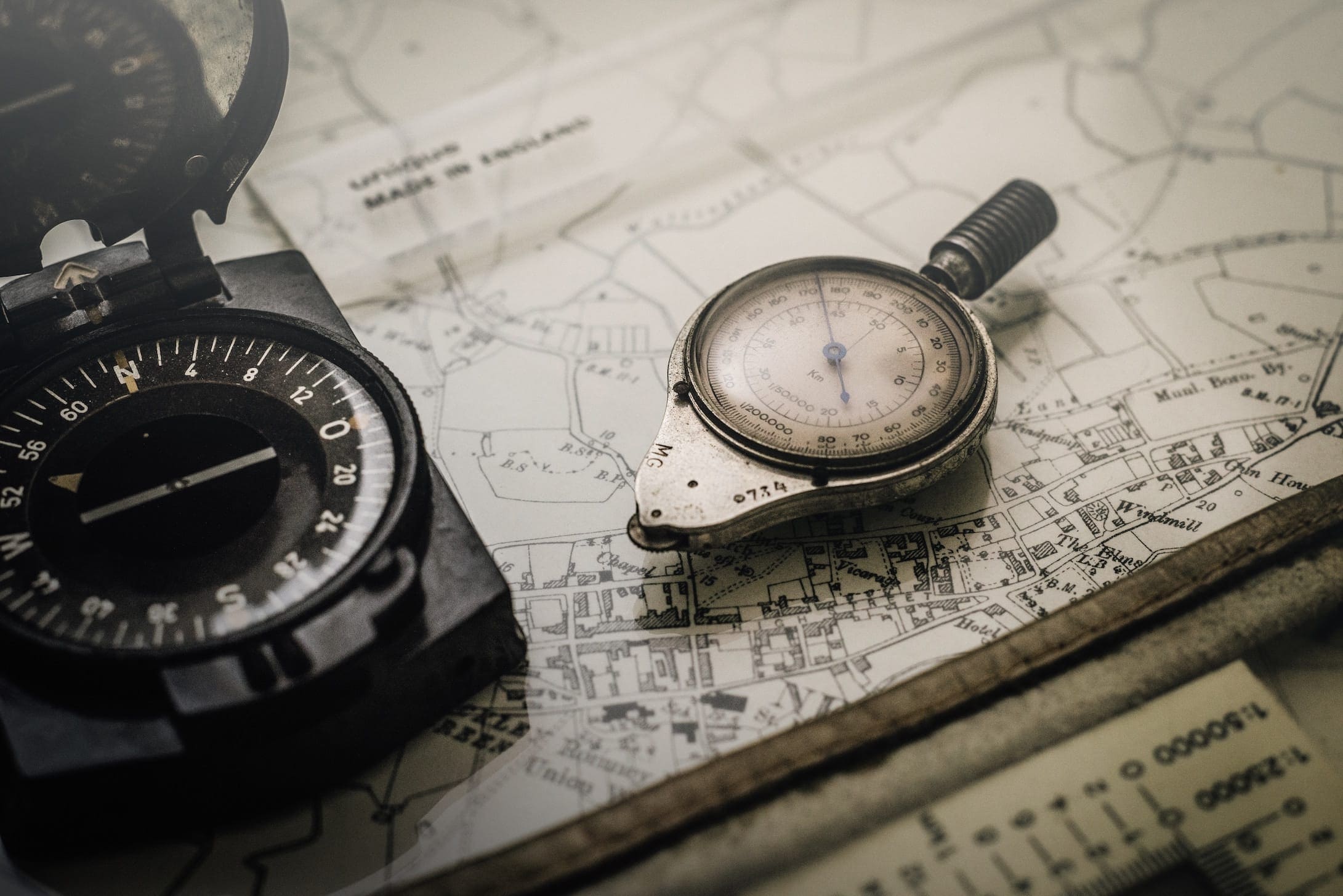 Compass rose and dividers laid on a nautical chart — the compass is the primary magnetic direction instrument on a yacht, indicating heading relative to magnetic north