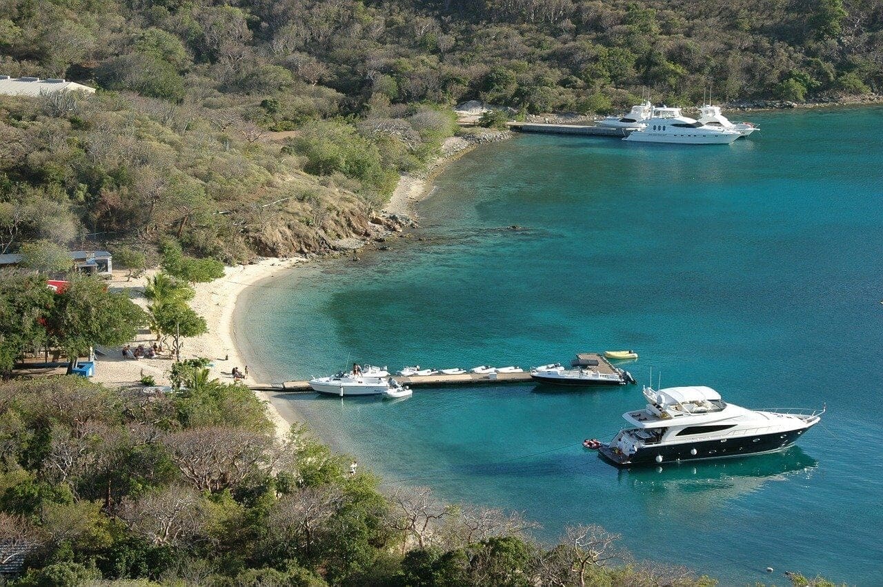 Boats moored off an island in the BVI
